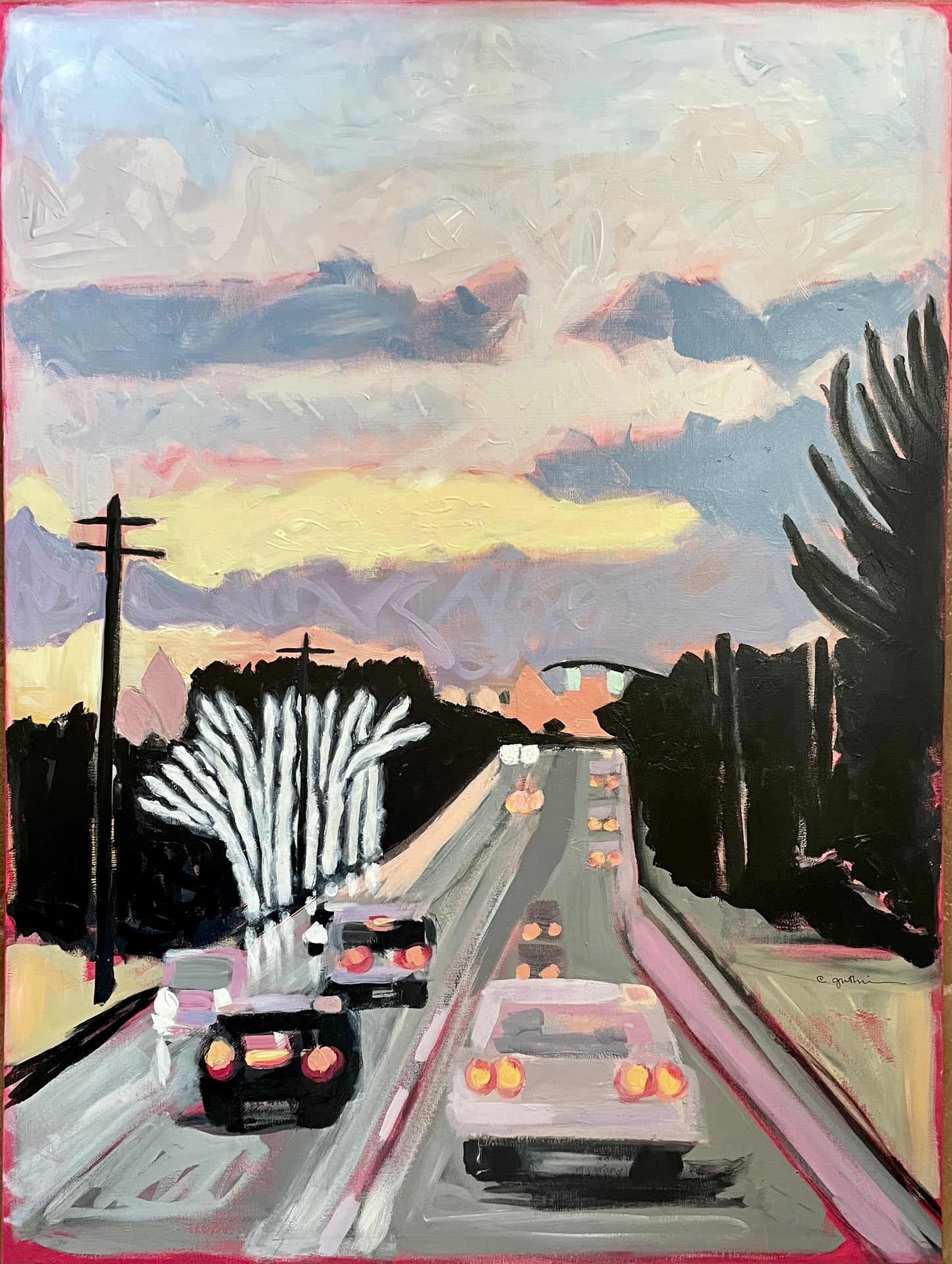 Winter cityscape at sunset with lighted trees and cars, with pastel sunset skies and reflections.