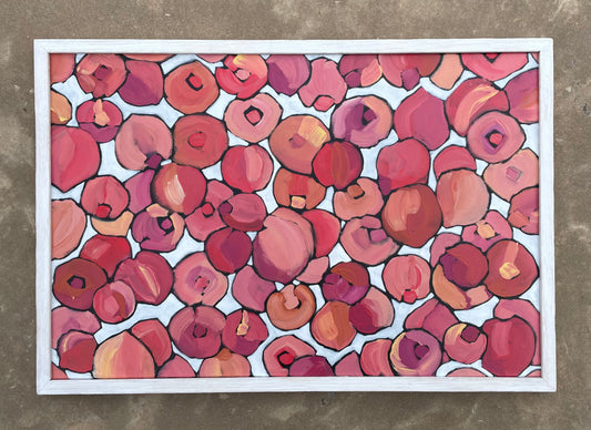 Abstract painting of colorful peaches covering the entire field with a white background.  Painting is framed with white wood.